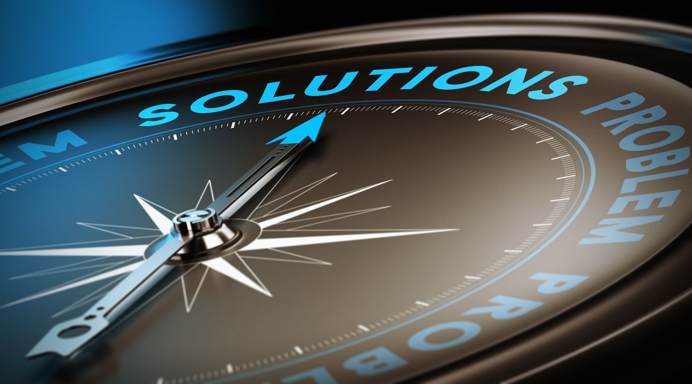 Compass needle pointing toward solutions text
